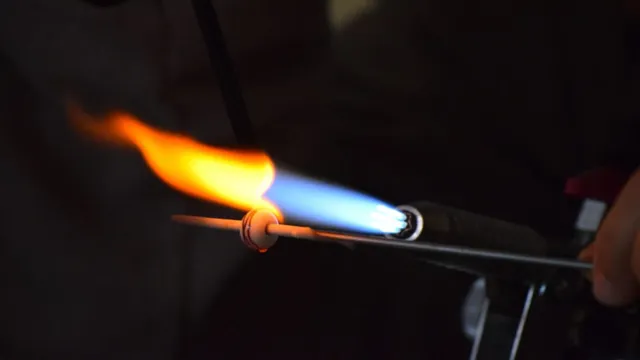 a welding torch produces a flame by burning